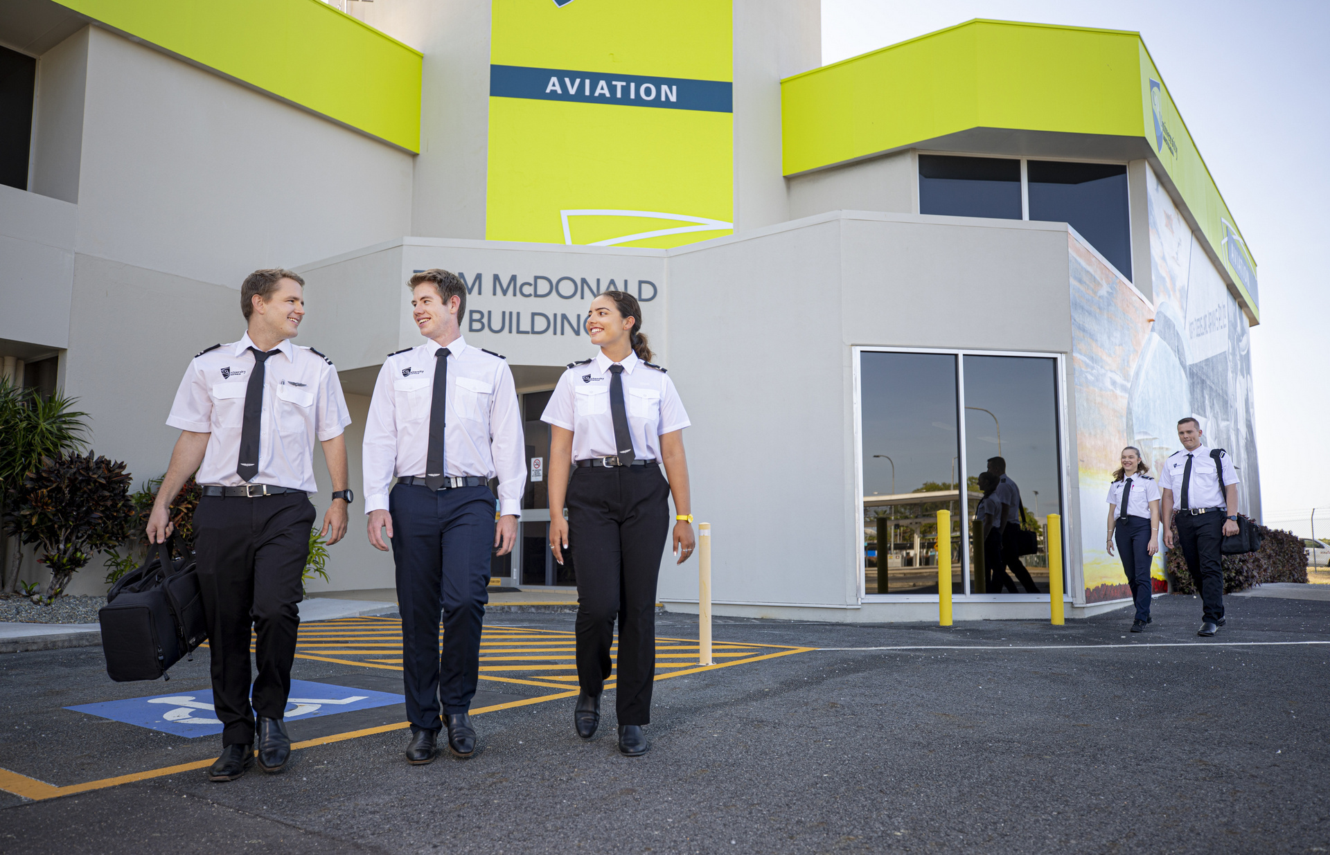 Central Queensland University aviation students exiting the campus